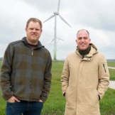 Hedin Automotive puts solar roof panels and farm’s wind energy to good use.